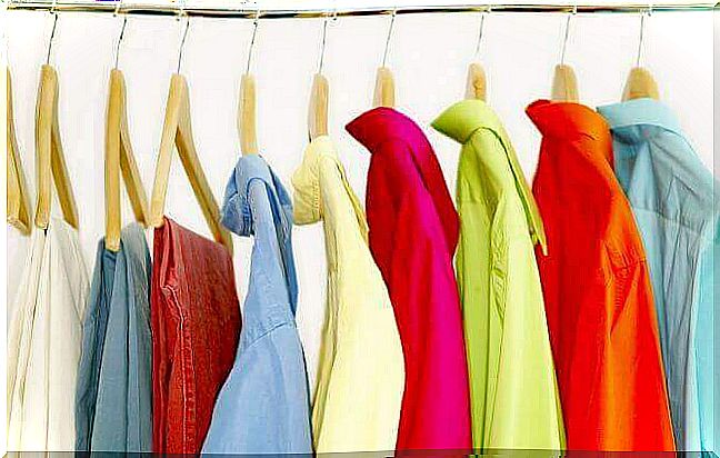 Colorful clothes hang on hangers