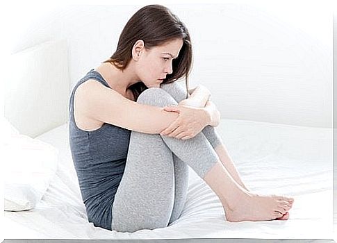 menstrual irregularities - a woman with period pains