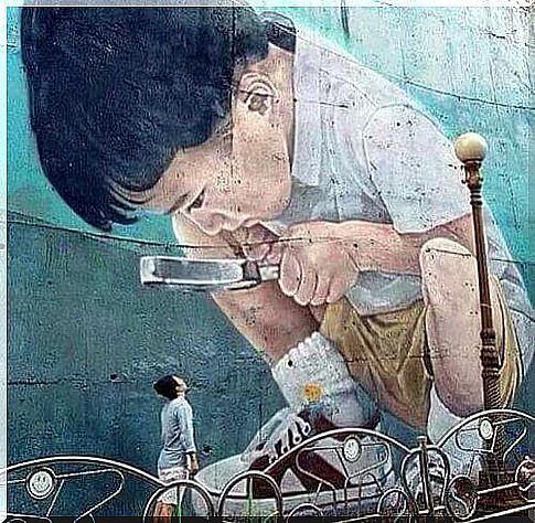 Mural - a child with a magnifying glass and a riddle