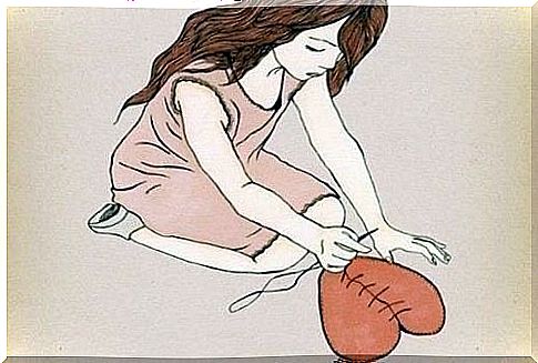 A woman stitching a heart - talking about feelings