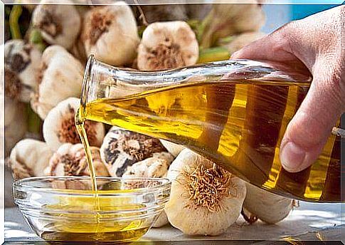 A bottle of oil and garlic.  Remedy for varicose veins